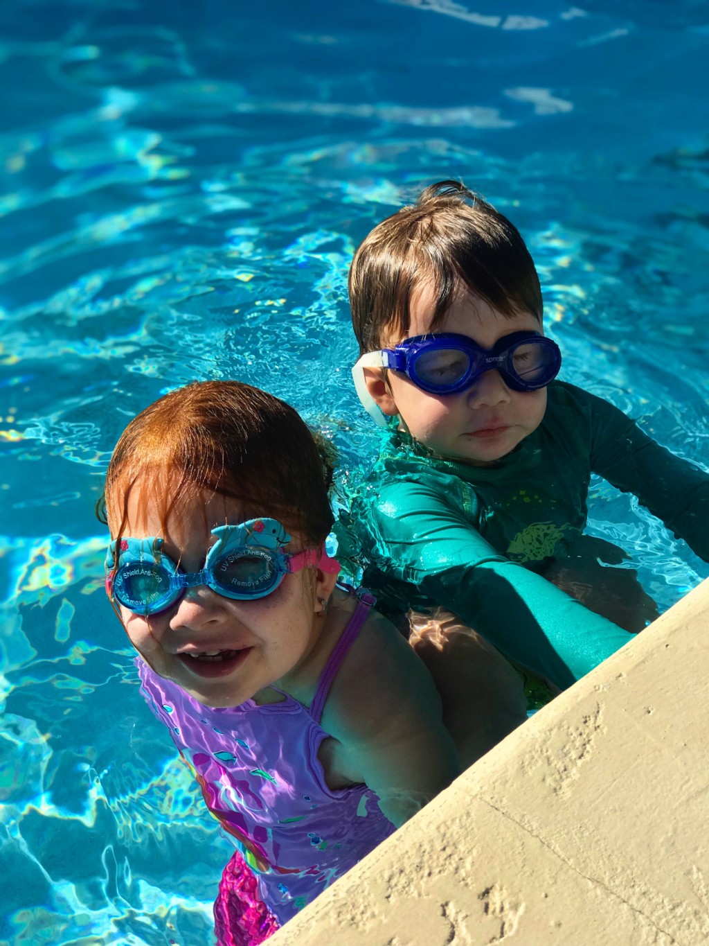kids in Miami, raising kids in Miami, kids swimming, kids in a pool