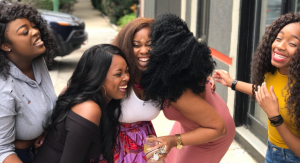 Image: A group of women laughing together