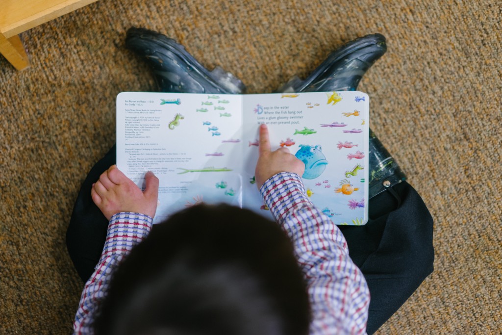 Boy reading board book. Books Are Fun! My Top 10 Books to Share With the Kids in Your Life Miami Moms Blog