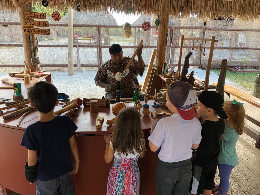 Image: Children learn about woodcarving chickee