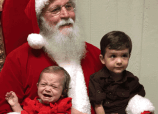 Image: A brother and sister visiting Santa Claus for the first time