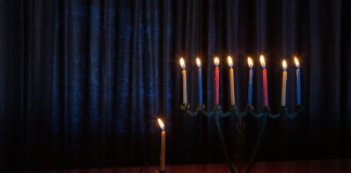 Celebrating Hanukkah: Helping My Kids Embrace Our Traditions A beautiful multicolored menorah
