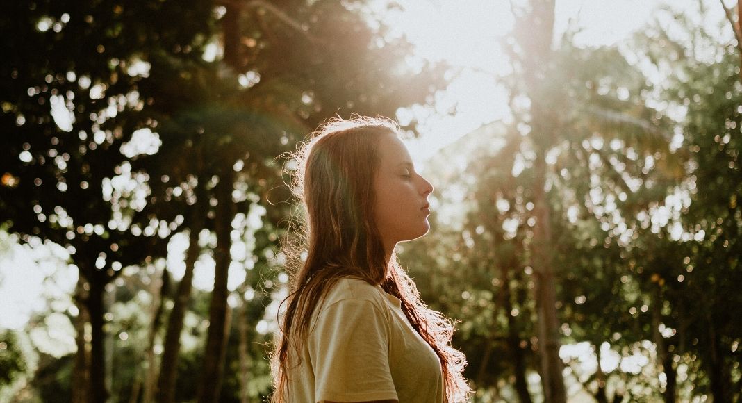 Image: A woman walking in the woods