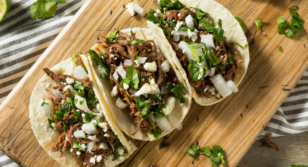 Image: Fresh homemade tacos on a wooden cutting board