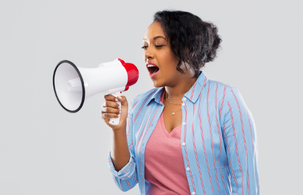 Image: A woman holding a megaphone