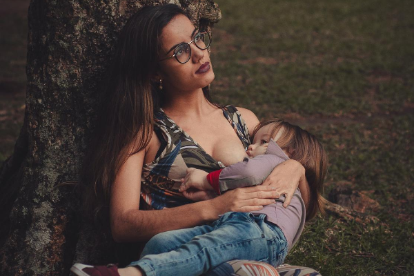 Image: A mom breastfeeds her toddler
