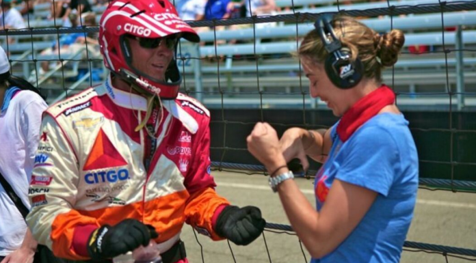 Image: Sandra works with a driver at the Indy500 in 2012