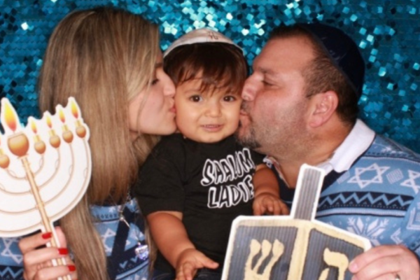 Image: A family poses for a fun Hanukkah photo