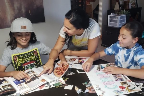 Illiett working on vision boards with her kids (Vision Boarding: How to Create a Vision Boards for Children Illiett Ojeda Contributor Miami Mom Collective)