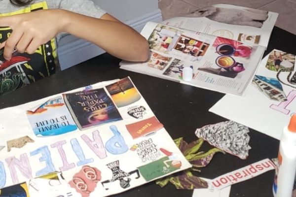 Working on a vision board (Vision Boarding: How to Create a Vision Boards for Children Illiett Ojeda Contributor Miami Mom Collective)
