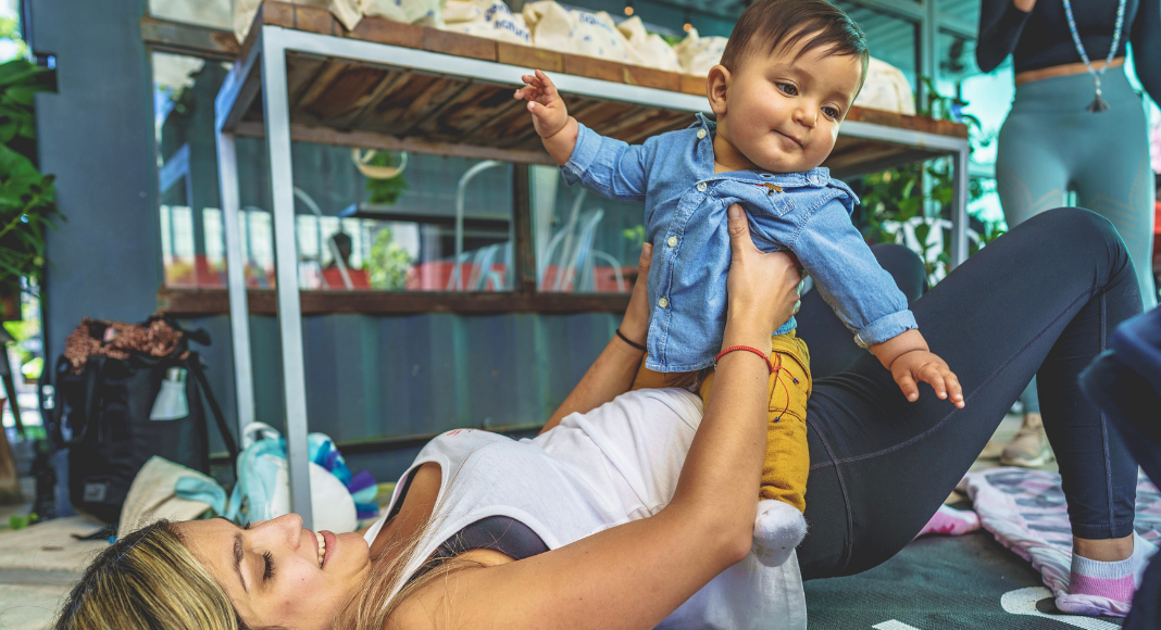 Bella exercising with her son (Baby Weight: How to Lose It Without Pressure Bella Behar Contributor Miami Mom Collective)