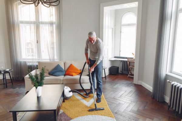 A man vacuuming (Husband Appreciation Day: Celebrate the Hubbies Lorena Lougedo Contributor Miami Mom Collective)