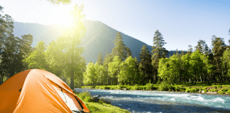 Tent camping in the mountains (Let’s Go Places! 5 Trips to Take Now Vanessa Santamaria Contributor Miami Mom Collective)