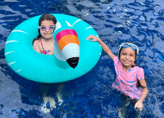 Vanessa's daughters playing in the pool (Sibling Rivalry: Tackle It With These 4 Strategies Vanessa Santamaria Contributor Miami Mom Collective)