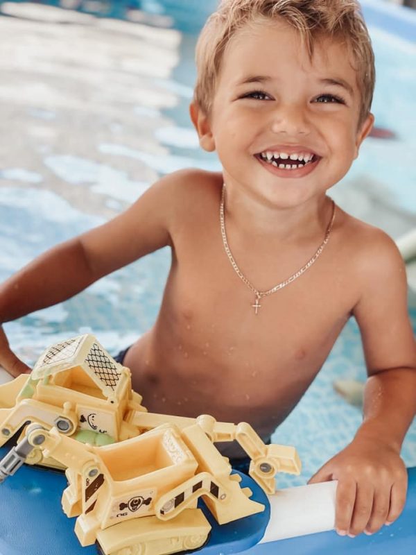 Dianna's son playing with some toys at the pool (Positive Affirmations for Toddlers and Preschool Children Dianna Hill Contributor Miami Mom Collective)