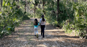 Two sisters hiking together (Sibling Rivalry: Tackle It With These 4 Strategies Vanessa Santamaria Contributor Miami Mom Collective)
