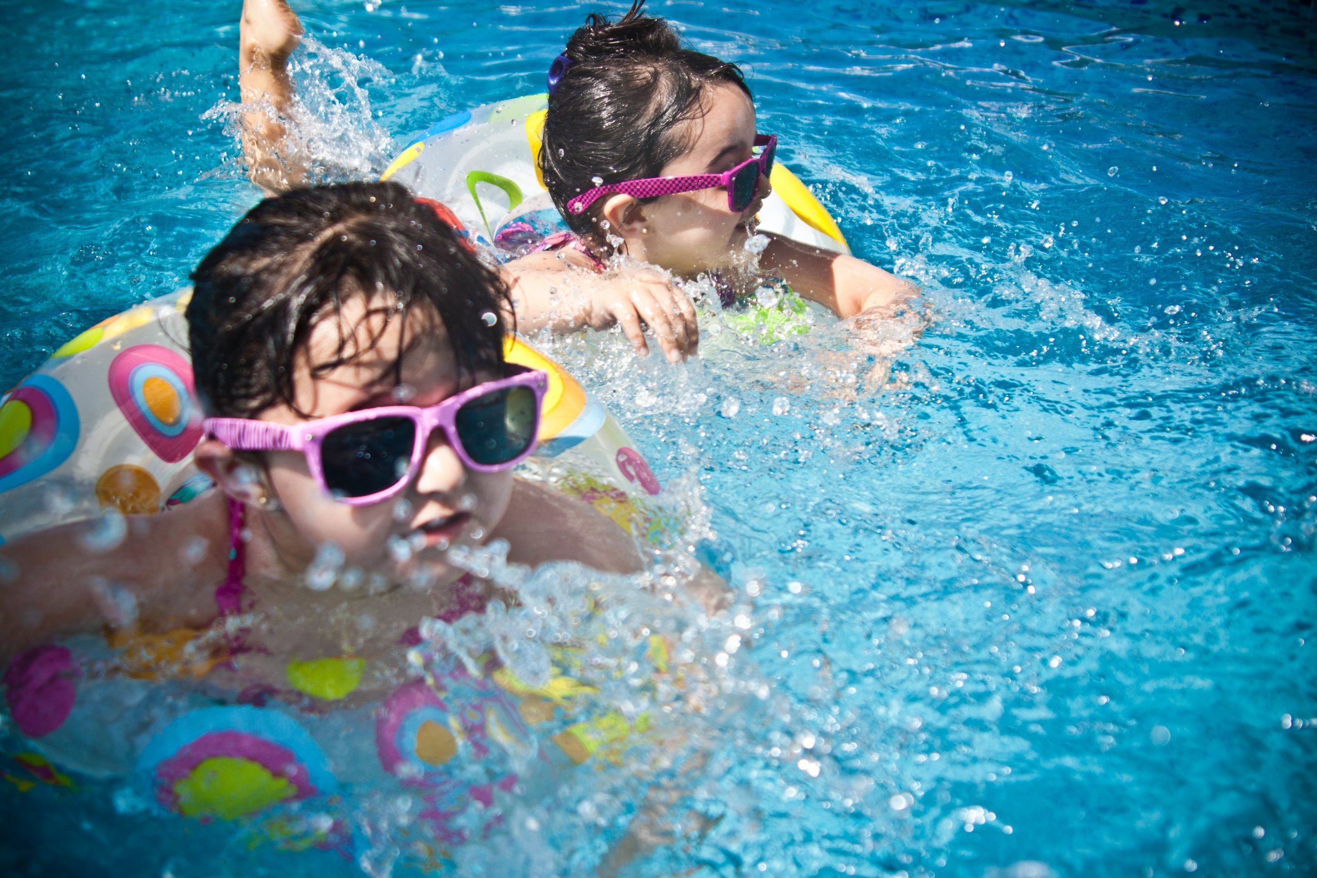 Sisters playing in the pool (Summer Fun that Leads to Lasting NEW Habits for the Entire Family Adita Lang Contributor Miami Mom Collective)