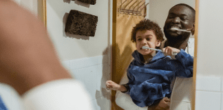 A father and son brushing their teeth (Favorite Things: Dr. Bob's Top 6 Dental Products for Kids Lynda Lantz Contributor Miami Mom Collective)