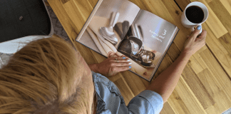 A woman looking at a book about ice cream (July is National Ice Cream Month: Give Me all the Sweetness! Rachel Hulsund Contributor Miami Mom Collective)