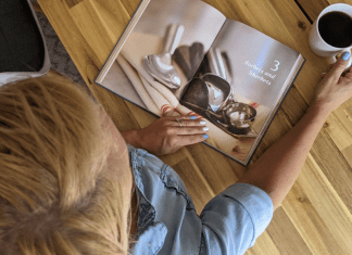 A woman looking at a book about ice cream (July is National Ice Cream Month: Give Me all the Sweetness! Rachel Hulsund Contributor Miami Mom Collective)