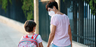 A mother and daughter walking to school (Kids and Tech: Back to School in a Pandemic Be Strong International Miami Mom Collective)