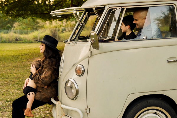 Image: Jacqueline nursing her daughter outside her VW bus (Jacqueline Jebian Garcia Contributor Miami Mom Collective)