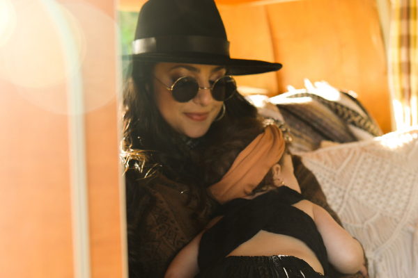 Image: Jacqueline snuggling her toddler-aged daughter (Weaning My Toddler Cold Turkey & Facing My Fear Jacqueline Jebian Garcia Contributor Miami Mom Collective)