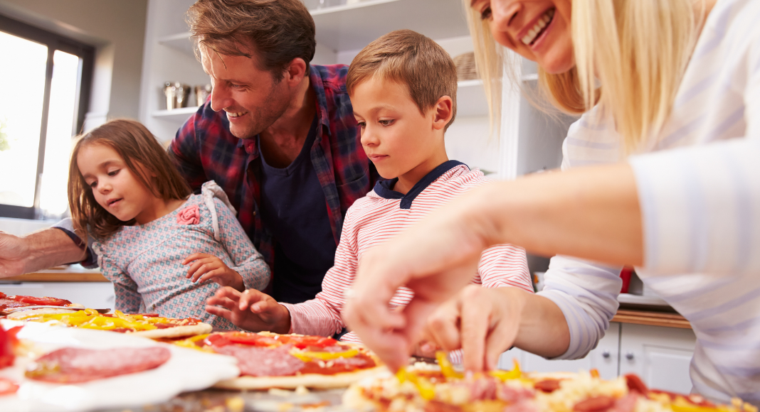 Image: A family making homemade pizza together (Pizza Night: 10 Homemade Pizza Ideas for a Fun Family Friday Night Lorena Lougedo Contributor Miami Mom Collective)