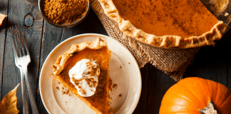Image: A slice of pumpkin pie on a festive table