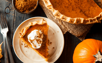 Image: A slice of pumpkin pie on a festive table