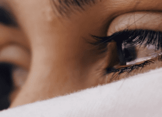 A woman crying (Am I Breaking My Kids? Dealing With Mom Guilt Janeris Marte Contributor Miami Mom Collective)