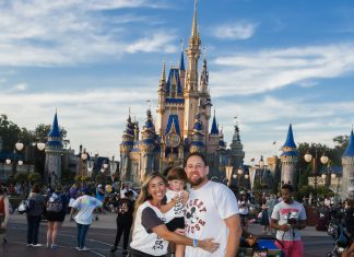 Image: Sandra with her husband and son in front of Cinderella's Castle at Disney (Disney at 50: Walt Disney World's Golden Birthday Celebration Sandra Jacquemin Contributor Miami Mom Collective)