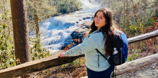 MMC Contributor Rachel Santos at a waterfall in Asheville, NC