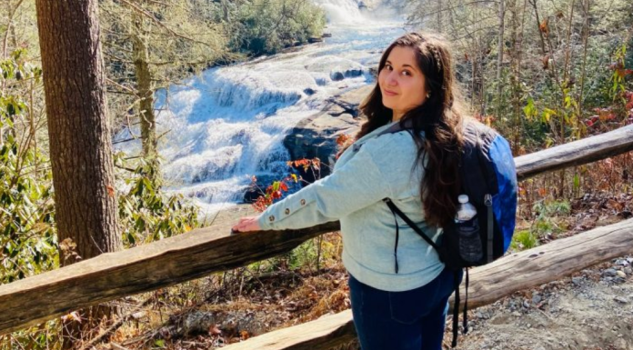 MMC Contributor Rachel Santos at a waterfall in Asheville, NC