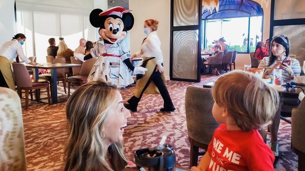 Walt Disney World is Celebrating the Magic Kingdom's 50th Anniversary, (and we were there for the inauguration). Sandra Jacquemin Image: Sandra and her son see Minnie Mouse at one of Disney's resorts (Sandra Jacquemin Contributor Miami Mom Collective)