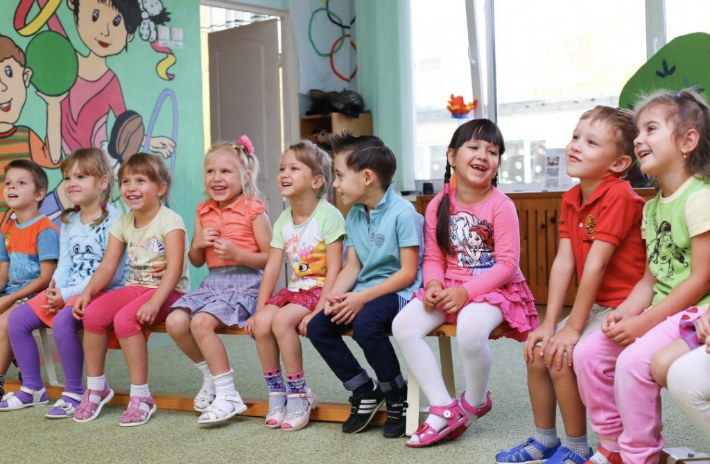 Image: A group of school children sitting in a circle (October is Dyslexia Awareness Month Sharonda Stewart Contributor Miami Mom Collective)