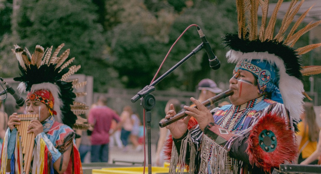 Image: Indigenous people playing traditional instruments