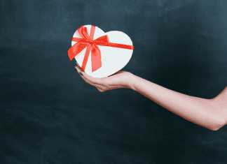 Image: An outstretched arm holding a gift box