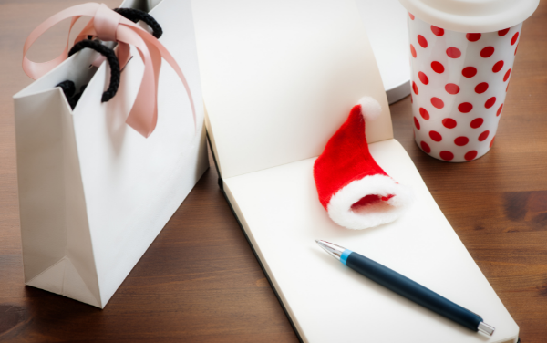 Image: A notepad, pen, and coffee cup