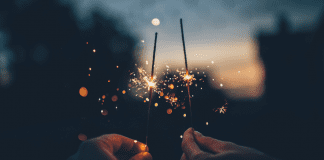 Image: Two hands holding sparklers (Blessings of 2021: A Season Not Wasted Kristin Parke Contributor Miami Mom Collective)