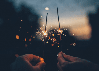 Image: Two hands holding sparklers (Blessings of 2021: A Season Not Wasted Kristin Parke Contributor Miami Mom Collective)