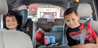 Image: Two kids in their car seats ready for a family road trip (Holiday Travel: 3 Ways to Balance Structure & Spontaneity | Dr. Bob Lynda Lantz Editor Miami Mom Collective)