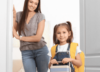 Image: A mom looks on as her daughter walks out the door, ready for school (School Mornings: 11 Hacks to Make Them Easy (Ok, "Easier") Candice Carricarte Contributor Miami Mom Collective)