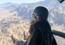 Morgan in a helicopter on a Holiday USO tour to visit our armed forces