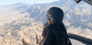 Morgan in a helicopter on a Holiday USO tour to visit our armed forces