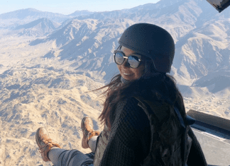 Morgan in a helicopter on a Holiday USO tour to visit our armed forces