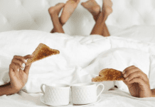 A couple enjoying breakfast in bed
