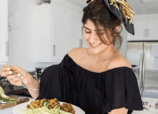 Michele holding a plate of homemade arroz con gandules