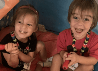 Two kids enjoying summer camp with their grandparents