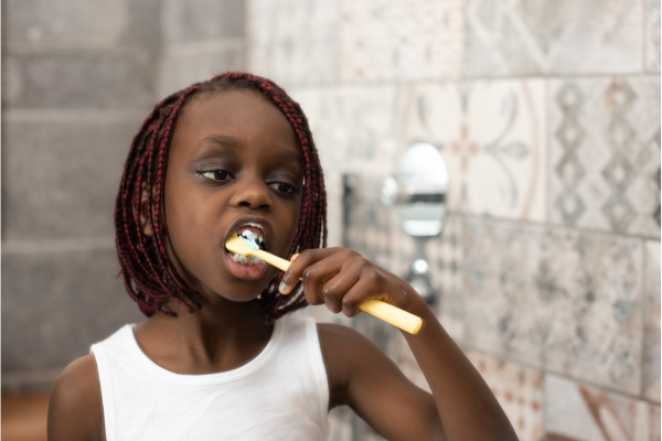 A girl brushing her teeth